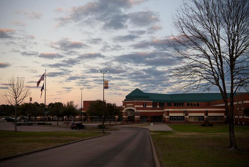 The sun sets over Lufkin High School in Lufkin on Jan. 29, 2023. Public school officials in rural areas like Lufkin face budget challenges because of proposed school choice legislation, which provides taxpayer-funded alternatives to sending a child to a local public school.