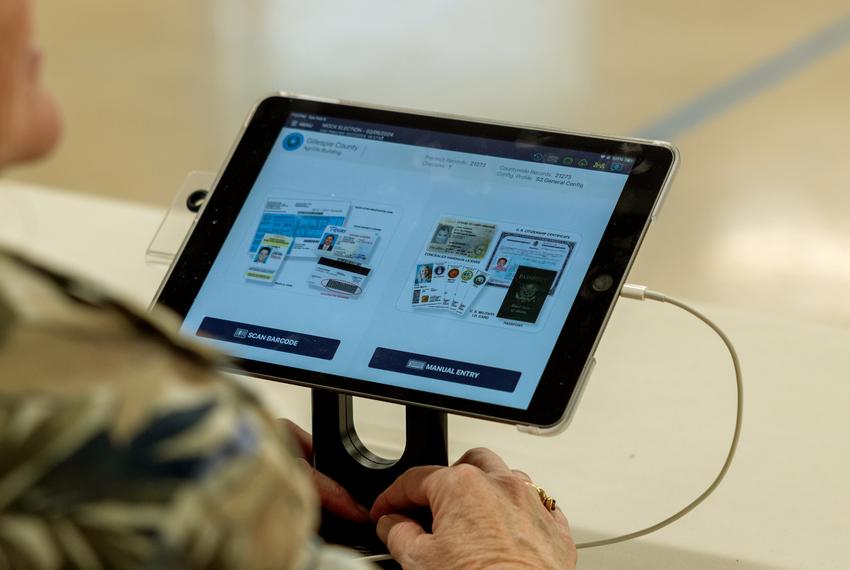 A poll pad with an ID check in is active prior to Gillespie County residents checking in for the mock election hosted on Feb. 6, 2024. The poll pad is used for voter check in and verification for county and precinct.