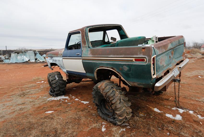 This pick-up truck sits in front of a home on State Highway 136. Residents have been working to recover from the Tuesday grass fires that devastated parts of the panhandle.