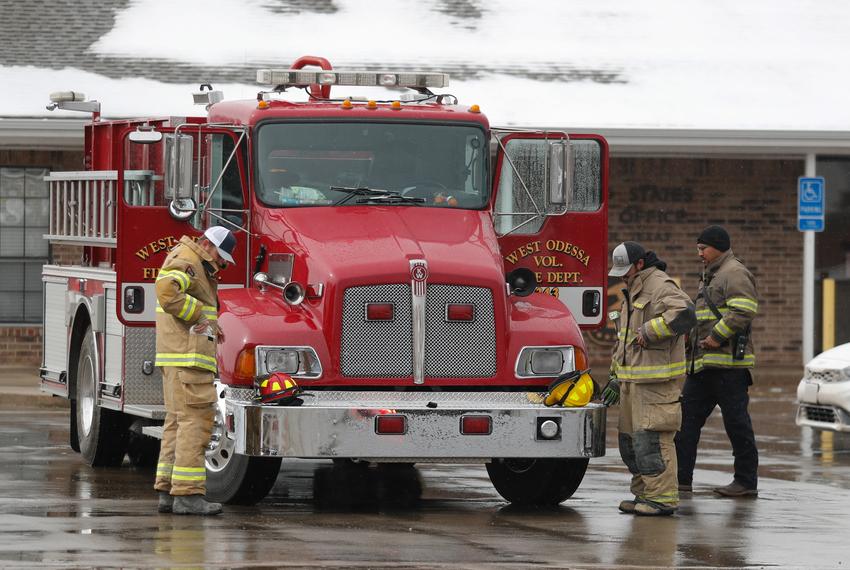 Members of the West Odessa Volunteer Fire Department ready their equipment in Fritch, Tx. Residents have been working to recover from the Tuesday grass fires that devastated parts of the panhandle.