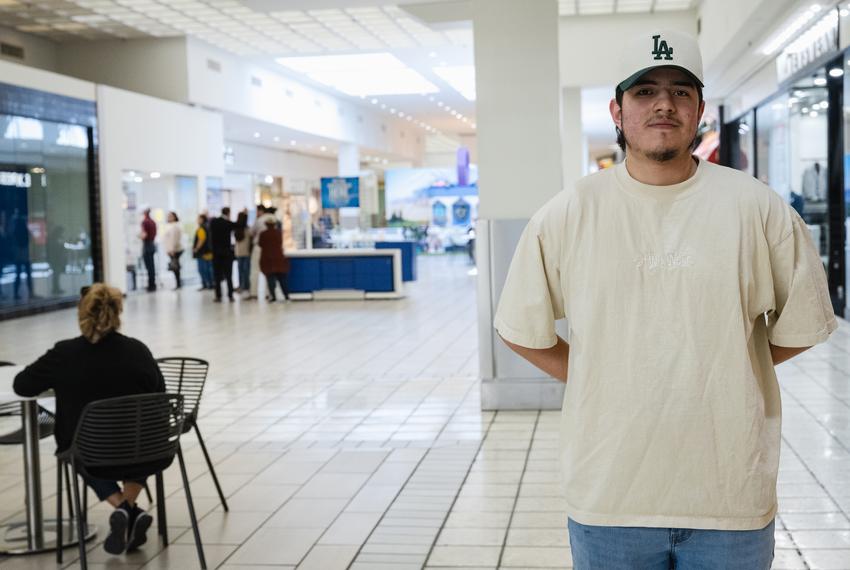 Rafael Valdes, 20, works in the Basset Place Mall. Valdes missed the voter registration deadline but plans to vote in the next election. People line up behind Valdes to cast their vote in El Paso, Texas on March 5, 2024.