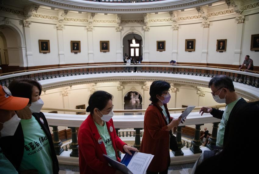 Hyunja Norman, executive director of Woori Juntos, leads her group through the state Capitol rotunda as they make their way to their next lawmaker meeting on Asian American Pacific Islander (AAPI) Advocacy Day on March 9, 2023. The group hoped to speak with lawmakers and seek support for bills that would improve language access for Korean and Spanish speakers in regards to health and social services,