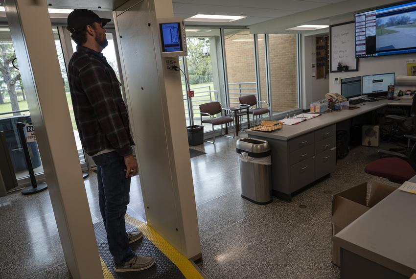 Texas A&M University reactor operator Thomas Freyman stands in a scanner to measure accumulated contaminates after working in the university’s Training, Research, Isotopes, General Atomics (TRIGA) nuclear research reactor control building Monday, March 11, 2024 in College Station.