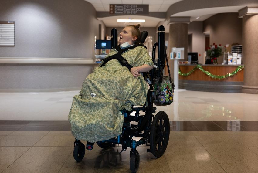 Kaitlyn Cunningham sits in her wheel chair in the hallway of Cedar Park Regional Medical Center in Cedar Park, Texas on Mar. 13, 2024. Cunningham and her mom Kathy Cunningham would walk down the hallway to look outside of the hospital windows at the birds.