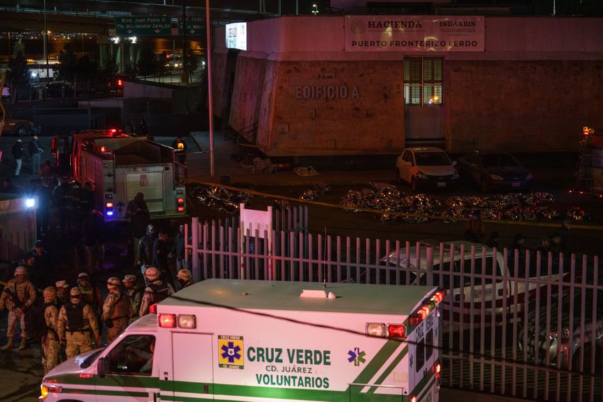 Bodies of those who died during the fire inside a Mexican detention facility were laid in a parking lot outside the offices of the National Migration Institute near the U.S.-Mexico border in Ciudad Juárez on March 27, 2023. The fire killed 40 immigrants and injured more than two dozen.