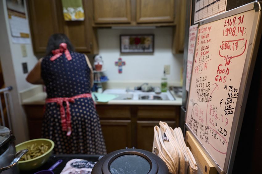 Mary Ann Estrella prepares homemade dog food inside her apartment in Midland, Texas, on April 20, 2024.