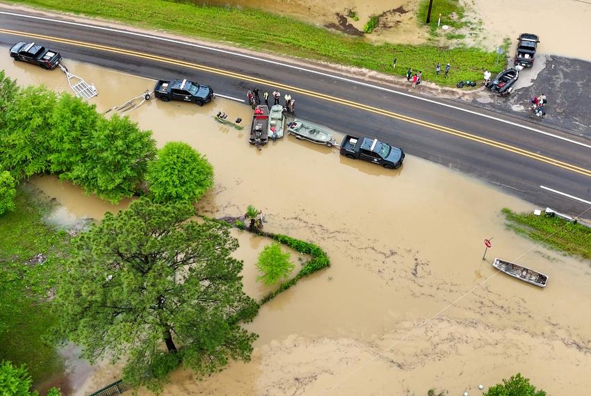 Emergency personnel respond to flooding on FM 1988 on May 2, 2024, in Livingston.