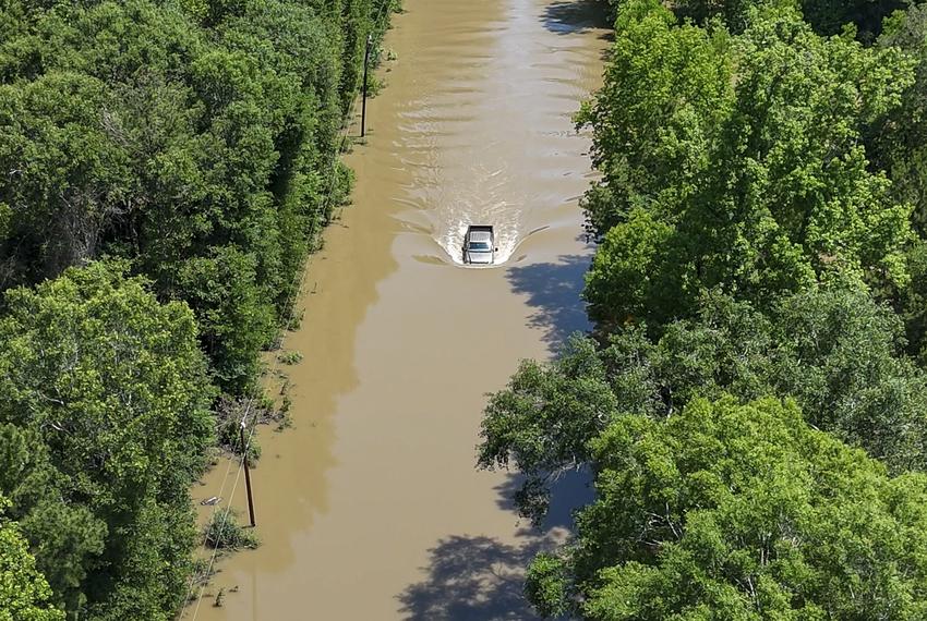 A truck in flood waters in Livingston on May 2, 2024. Thousands fled their Southeast Texas homes as heavy rains saturated land in multiple counties.