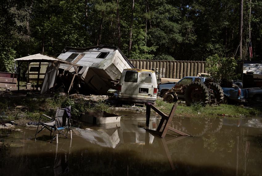 Vehicles and other damaged items line a street in Harris County outside Houston, Texas, on May 14, 2024.