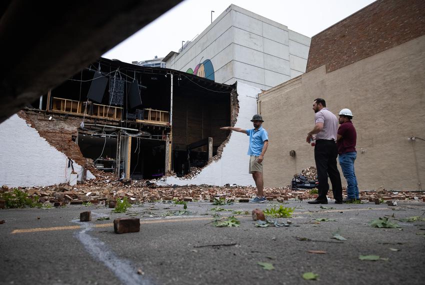 People survey a partially collapsed section of Conejo Malo in downtown, Friday, May 17, 2024, in Houston. (Antranik Tavitian / Houston Landing)