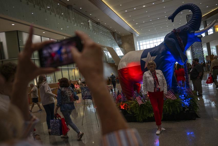 Nancy Leclerc poses for a photo in front of a GOP elephant statue during the Texas GOP Convention Thursday, May 23, 2024 in San Antonio.