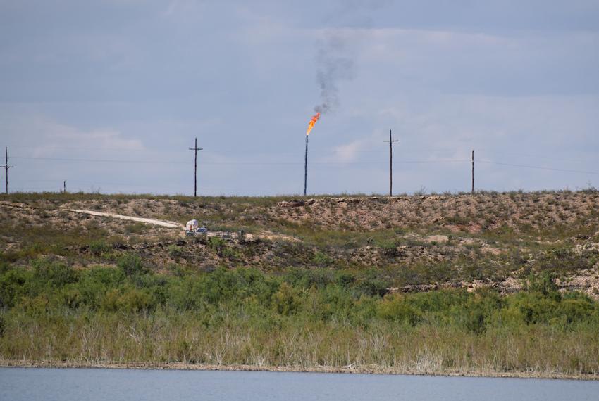 A methane gas flare burns four miles from the Red Bluff Reservoir in Reeves County, Texas on February 24, 2020. NGL Water Solutions Permian has proposed to discharge treated produced water into the reservoir.