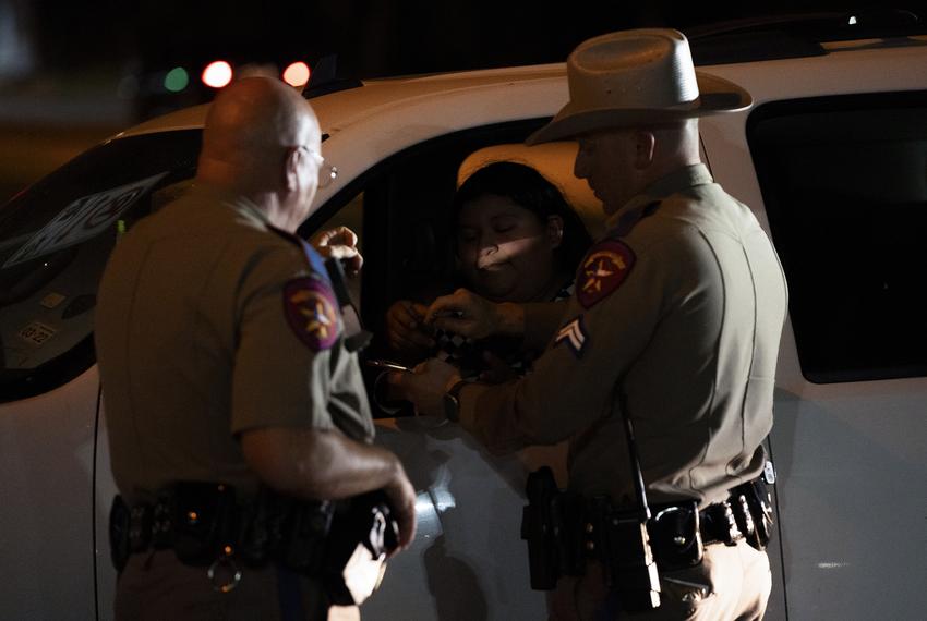 DPS troopers make a traffic stop in southeast Austin on Aug. 7, 2023.