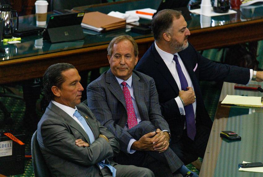 Ken Paxton sits with attorneys Tony Buzbee and Mitch Little on the ninth day of suspended Attorney General Ken Paxton’s impeachment trial at the state capitol in Austin, Texas, on Sept. 15, 2023.