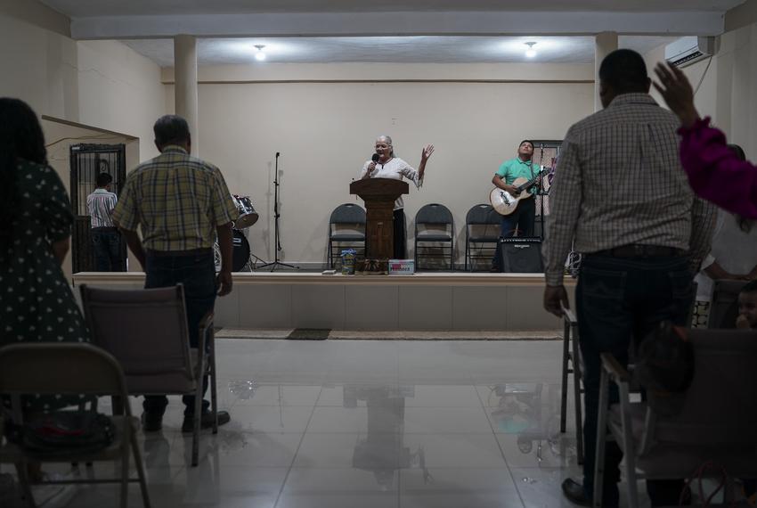 Pastor Estela Prieto Covarrubias leads the worship at her church in Tamaulipas on Sept. 17, 2023.
