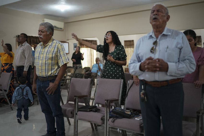 Claudia González, 36, worships at her church in Tamaulipas, México on Sept. 17, 2023. After living in Texas for two decades and receiving a work permit through DACA, she applied for her green card, hoping to become a legal permanent U.S. resident.