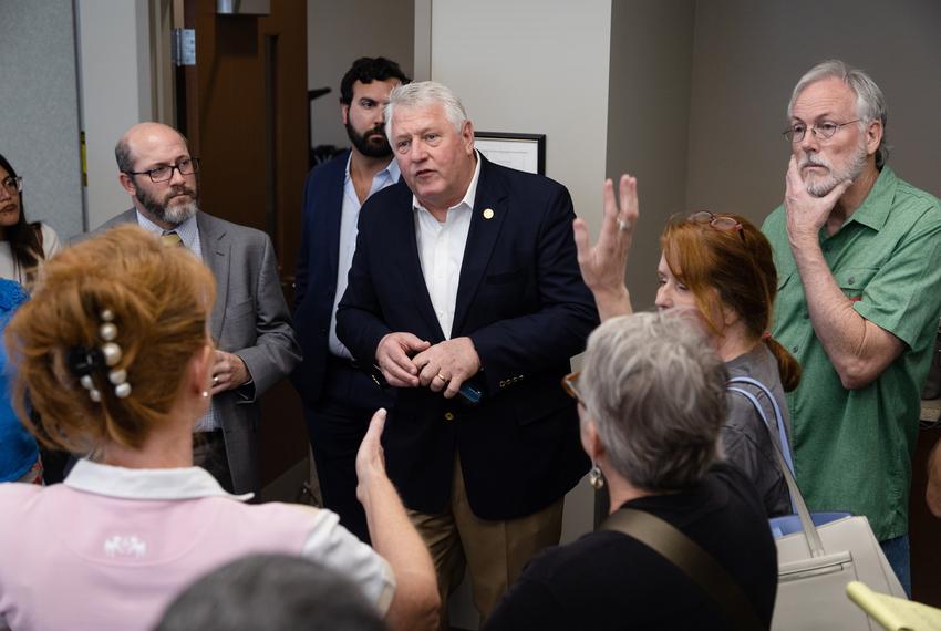 Secetary of State John Scott listens to members of the public while they ask questions about the voting during a state-mandated logic and accuracy test at the Hays County Government building in San Marcos on Sept. 21, 2022. Questions mainly revolved around the saftey of the procedure of the voting machines, and the precautions the department was taking to elliminate errors within the counting process.