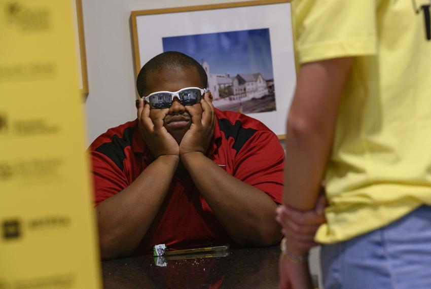 A venue security guard takes a rest between panels at The Texas Tribune Festival in Austin, TX on Sept. 22, 2023.