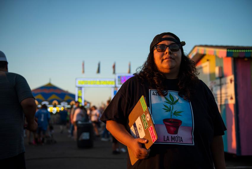 Giselle Ramirez stands with her clipboard of signatures to support the petition to legalize marijuana in Lubbock at the South Plains Fair Monday, Sept. 25, 2023, in Lubbock, Texas.