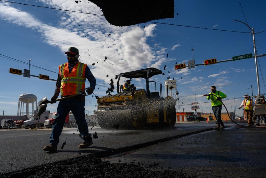 Texas Department of Public Safety contractors pave the intersection of Austin Street and Pine Street Wednesday, Nov. 8, 2023 in Kermit. The intersection, according to the mayor of Kermit, David Holbrook, is one of the busiest in town with a large majority of the traffic consisting of 18-wheelers hauling sand for the oilfields.