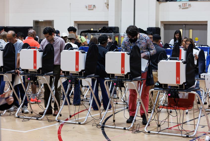 People cast their ballots at the Metropolitan Multi-Service Center in Houston on Nov. 8, 2022.