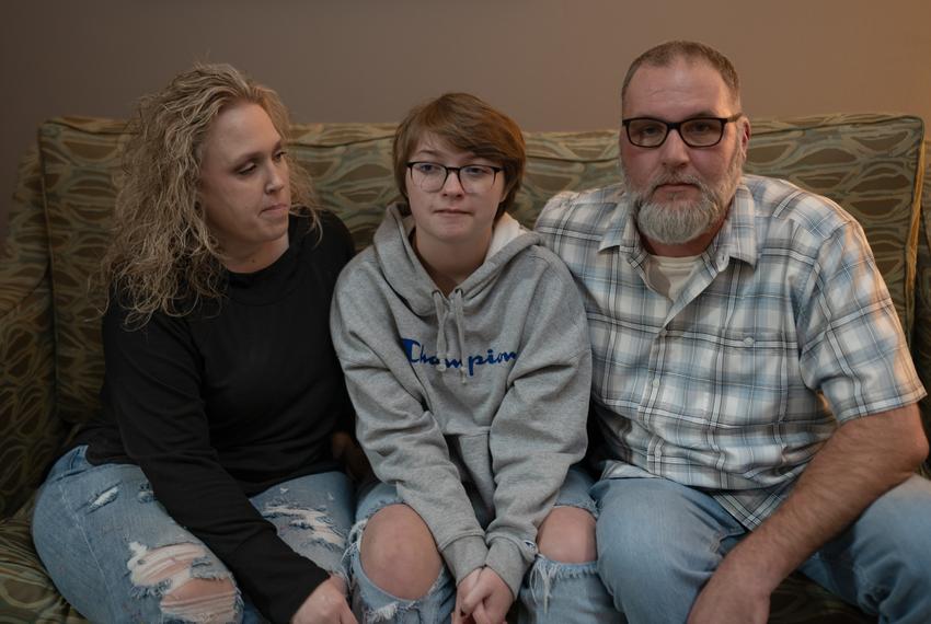 Amy and Phillip Hightower sit with their son Max Hightower in a hotel in Denton on Nov. 9, 2023.