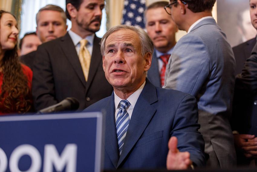 Texas Gov. Greg Abbott signs a bill banning COVID-19 vaccine mandates, at the Governor's Mansion in Austin on Nov. 10, 2023.