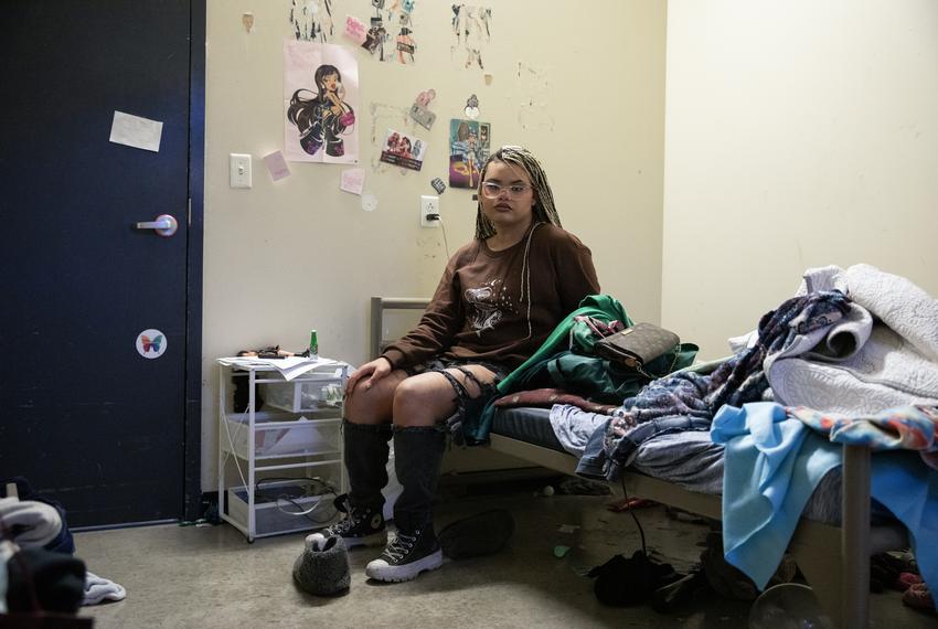 Isabella Morningstar, 21, poses for a portrait in her room at the Thrive Youth Center on Nov. 21, 2023. Morningstar spent much of her youth in the foster care system. When she was a teenager she says she was continuously deadnamed, discriminated against for dressing feminine and denied acknowledgment of her being a trans girl.