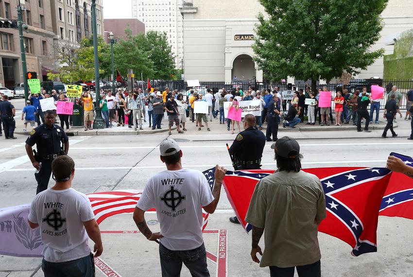 About a dozen people protested against what they called the threat of radical Islam, at the Islamic Da'Wah Center on Saturday, May 21, 2016, in Houston. They were met by several dozen counter-protesters.