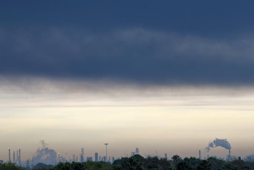 A thick layer of smoke hangs in the air from a fire burning at the Intercontinental Terminals Company in Deer Park, east of Houston, Texas, U.S., March 18, 2019.