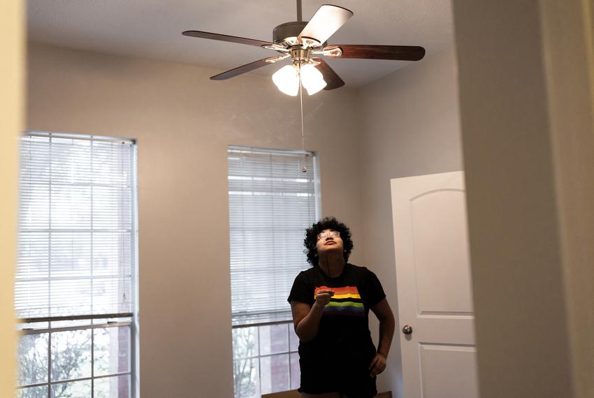 Kadence Carter, 17, holds incense in the empty bedroom he took in the League City home where he recently moved with his father, William Carter, on Feb. 16.