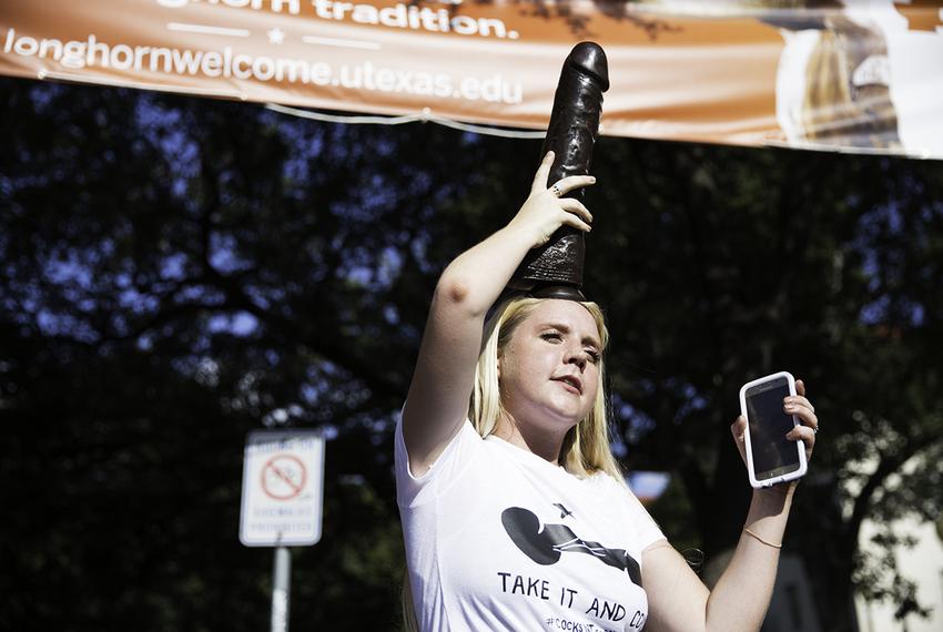 UT-Austin junior Rosie Zander displays a dildo as part of the Cocks Not Glocks protest of Texas' campus carry law on Aug. 23, 2016.