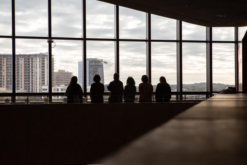 Members of ATXKind chat with one another at Austin City Hall on Nov. 17.