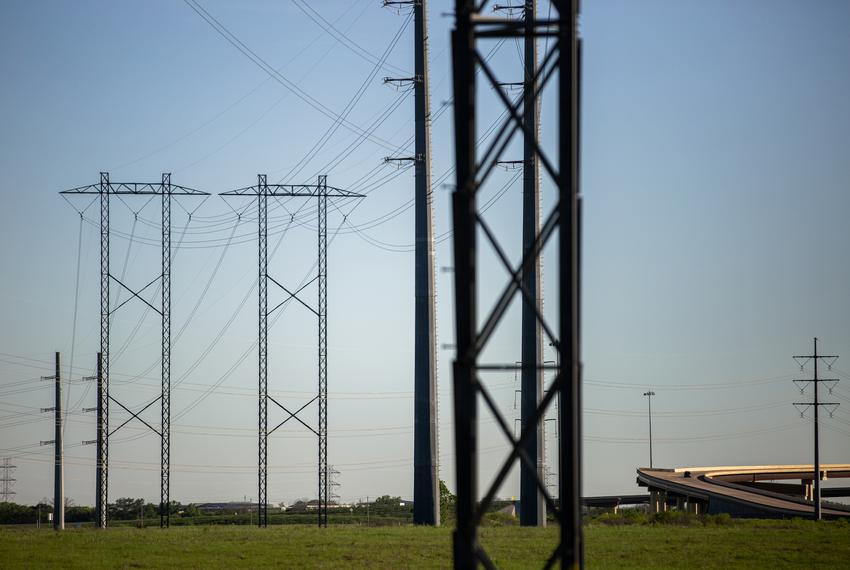 Electrical power lines near the Austin Energy/Sand Hill Energy Center in Del Valle on March 24, 2020.