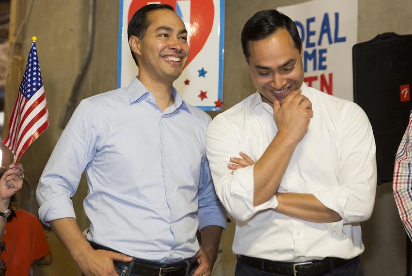 HUD Secretary Julián Castro, left, and his twin brother, U.S. Rep. Joaquin Castro, D-San Antonio, attend a Day of Action on Oct. 29, 2016, at the Travis County Democratic Party headquarters in Austin.