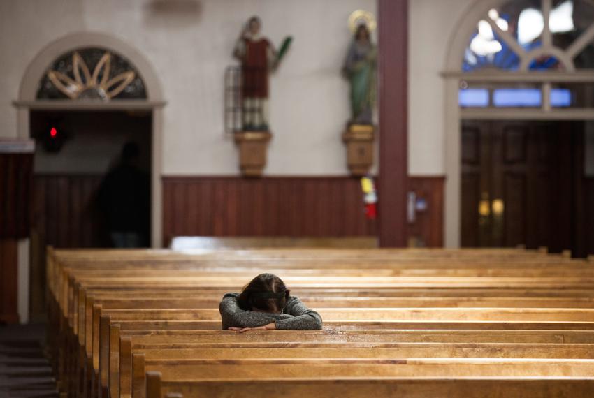 A parishioner prays in a church in Texas. 
