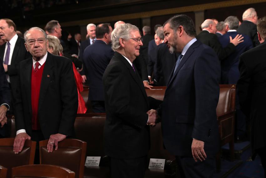 U.S. Senate Majority Leader Mitch McConnell shakes hands with Sen. Ted Cruz during U.S. President Donald Trump's State of the Union address to a joint session of the U.S. Congress in the House Chamber of the U.S. Capitol in Washington on Feb. 4, 2020.