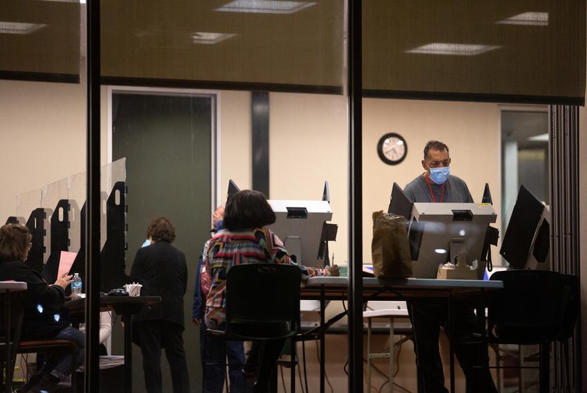 Voters cast their ballots at the Lochwood Branch Library in Dallas on Feb. 25, 2022, the last day of early voting in the Texas primary. Dallas County voting centers’ hours were extended till 10 P.M. on the last day of early voting to make up for early closures due to icy weather.