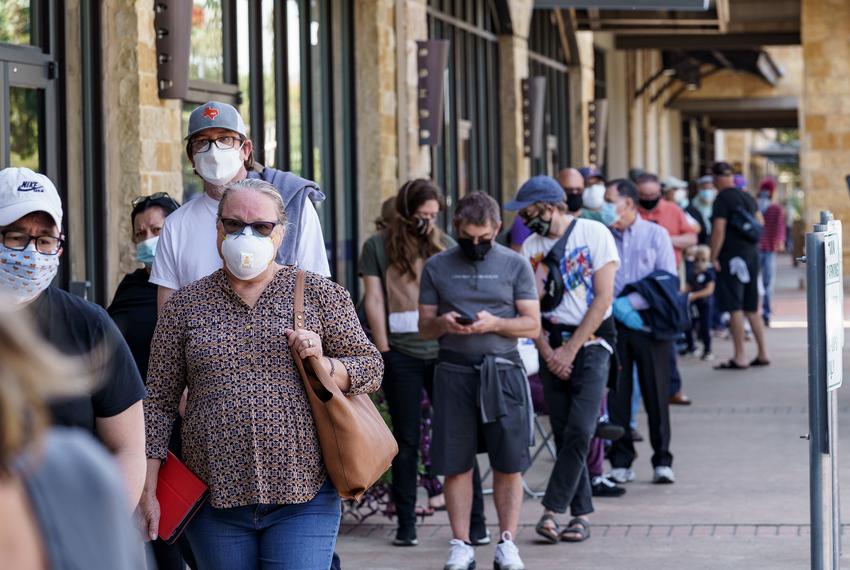 Some voters waited for more than three hours to cast their ballot at a shopping center in South Austin on the first day of early voting.