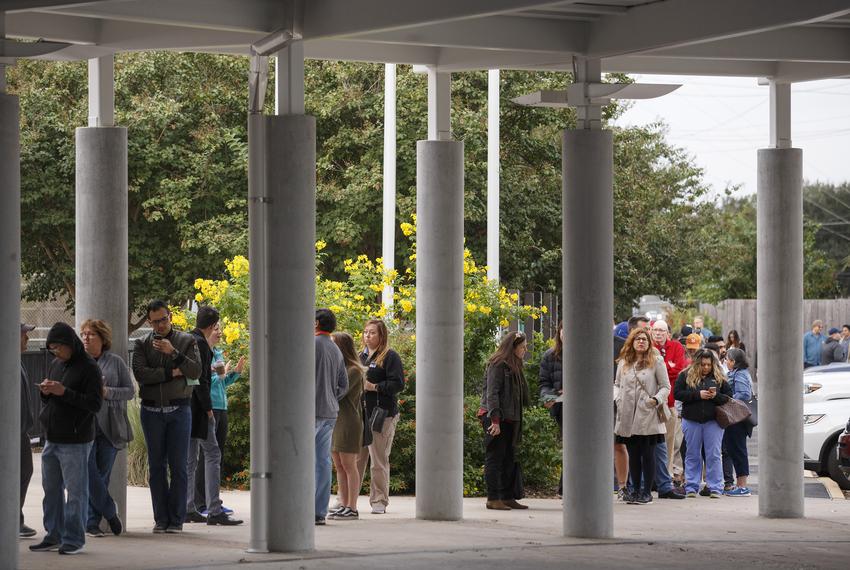 Long lines for the start of early voting snaked around the parking at the Metropolitan Multi-Service Center near downtown Houston on Monday, Oct. 22, 2018.