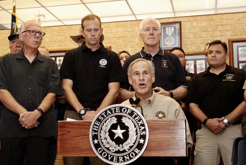 Gov. Greg Abbott (center) at a press conference with State Rep. Todd Hunter (left), FEMA Director Brock Long and U.S. Sen. John Cornyn, R-Texas,(center) in Corpus Christi on Aug. 28, 2017.