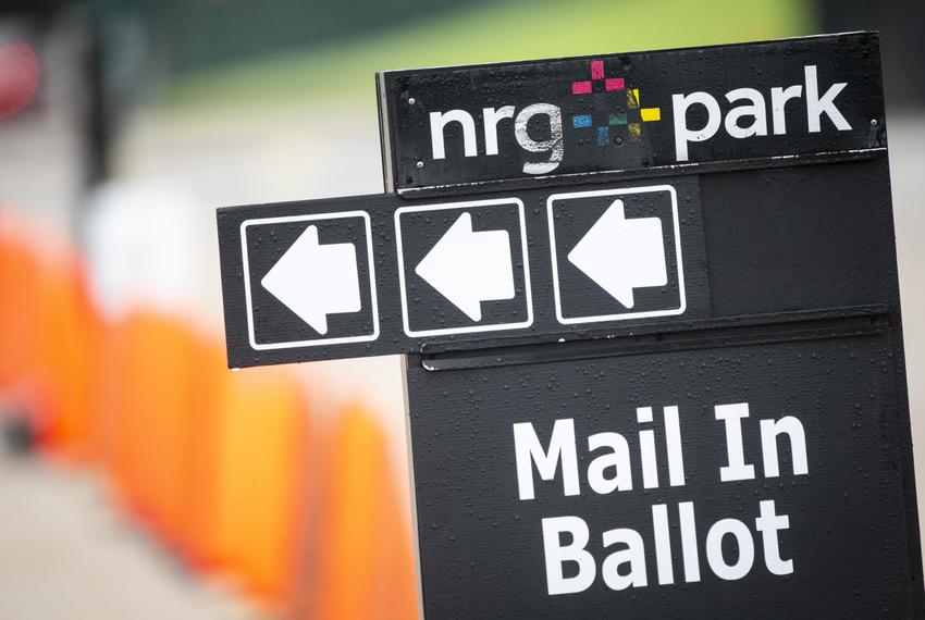 Signs direct voters at the Harris County ballot drop-off site at NRG Stadium in Houston on Oct. 28, 2020.