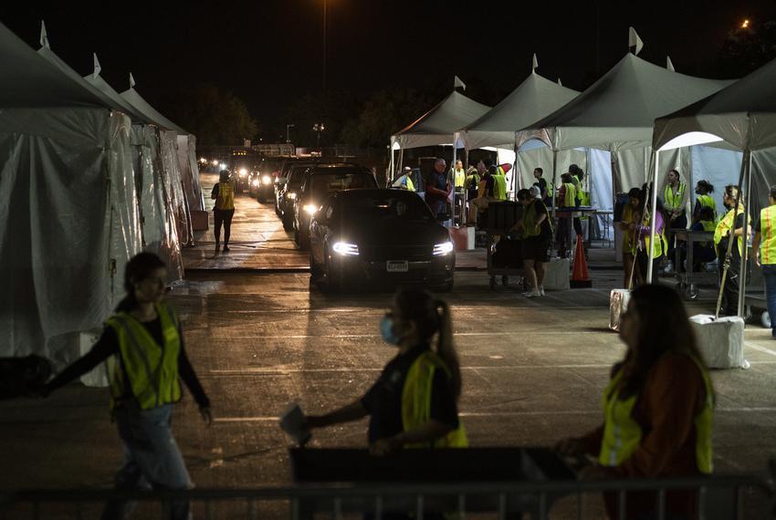 Election judges and Harris County employees wait in line to drop off ballots and supplies from polling locations at NRG Arena Tuesday, May 24, 2022, in Houston, Texas.