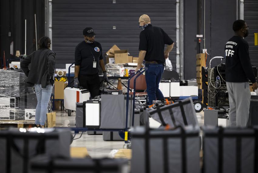 Harris County Elections Staff members sort ballot bags at the Elections Technology Center in northwest Houston on Tuesday, March 1, 2022.