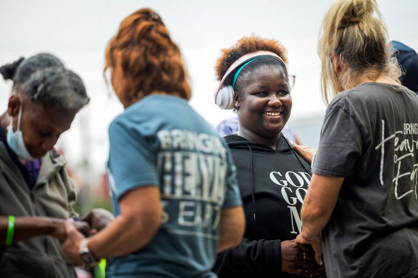 Danielle Stephen, 20, participates in a Christian service May 8 in Houston's Montrose neighborhood. Stephen, who was kicked off campus and into the streets as a high school student, attended the outdoor service to support people struggling with homelessness.