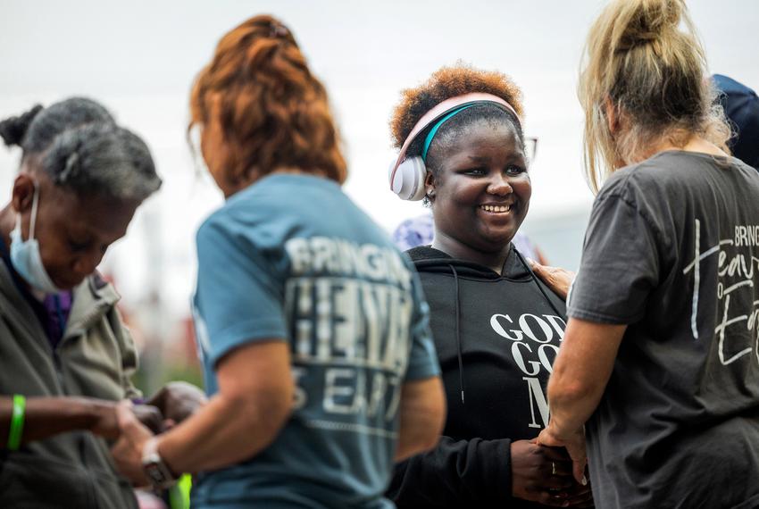 Danielle Stephen, 20, participates in a Christian service May 8 in Houston's Montrose neighborhood. Stephen, who was kicked off campus and into the streets as a high school student, attended the outdoor service to support people struggling with homelessness.