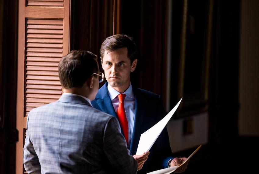 State Rep. Mayes Middleton, R-Wallisville, speaks to state rep. Briscoe Cain, R-Deer Park, on the House floor on Monday August 9, 2021.