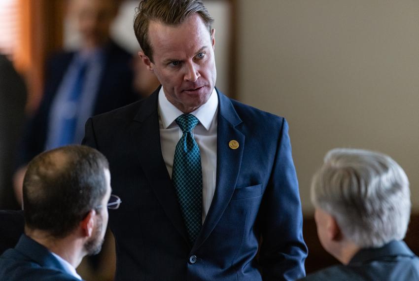 Speaker of the House Dade Phelan, center, speaks with Gov. Greg Abbott, right, and State Rep. Ben Leman, R-Anderson, left, on the House floor on Sunday, May 23, 2021.