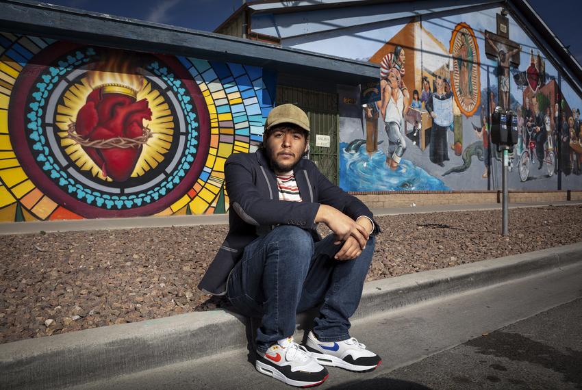 Juan Paul Flores Vazquez stands in front a mural in Segundo Barrio in El Paso. Flores is a DACA recipient. 