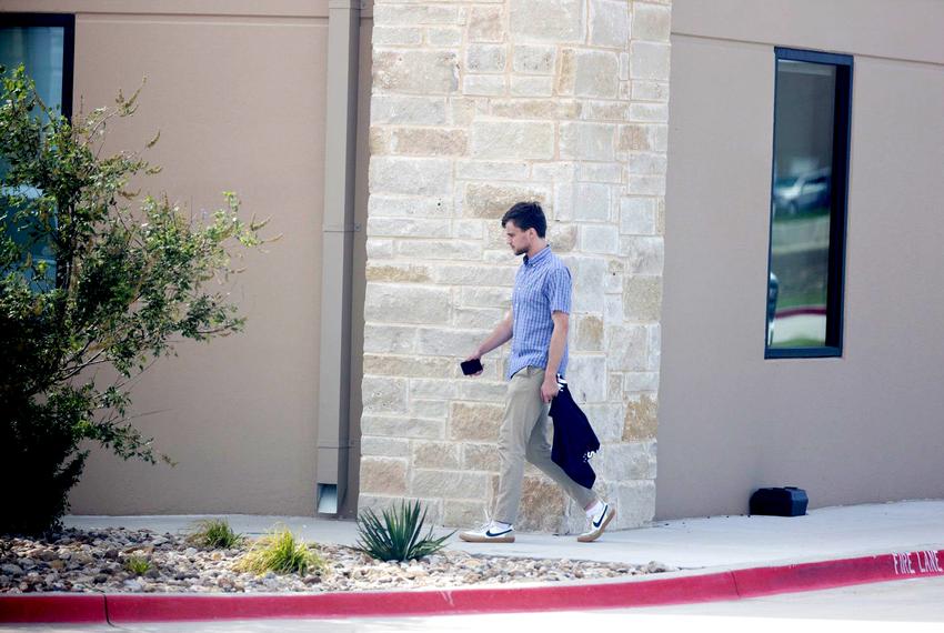 Konner Earnest outside of the offices of Pale Horse Strategies in Fort Worth on Oct. 6, 2023. Earnest is an associate of Nick Fuentes and also worked on former state Sen. Don Huffines' gubernatorial campaign in 2022.